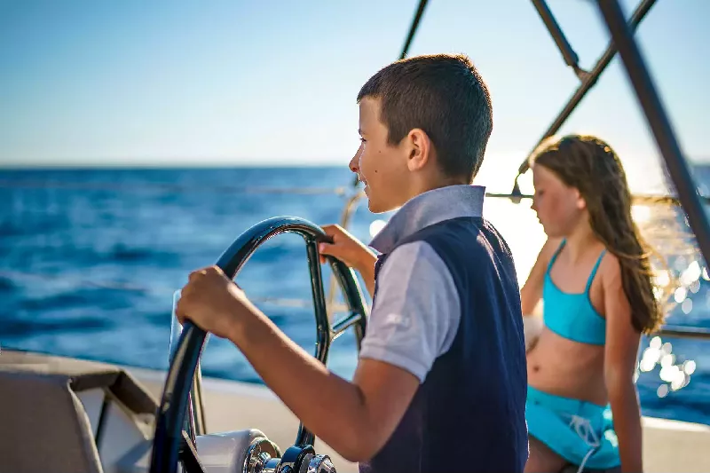 kids sailing, boating with a toddler, young kid on a yacht, sailing activities for kids, family sailing adventure