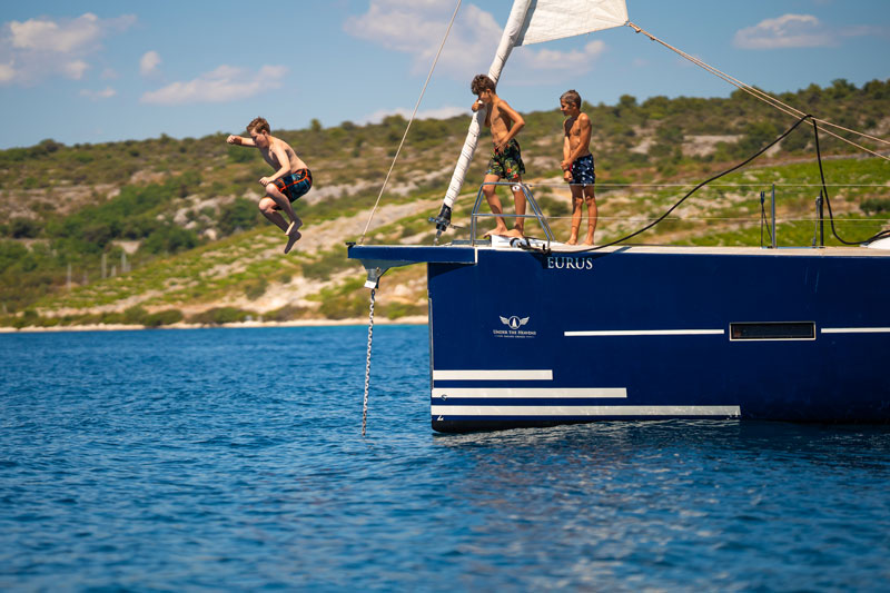 children enjoying spending time on a sailing boat