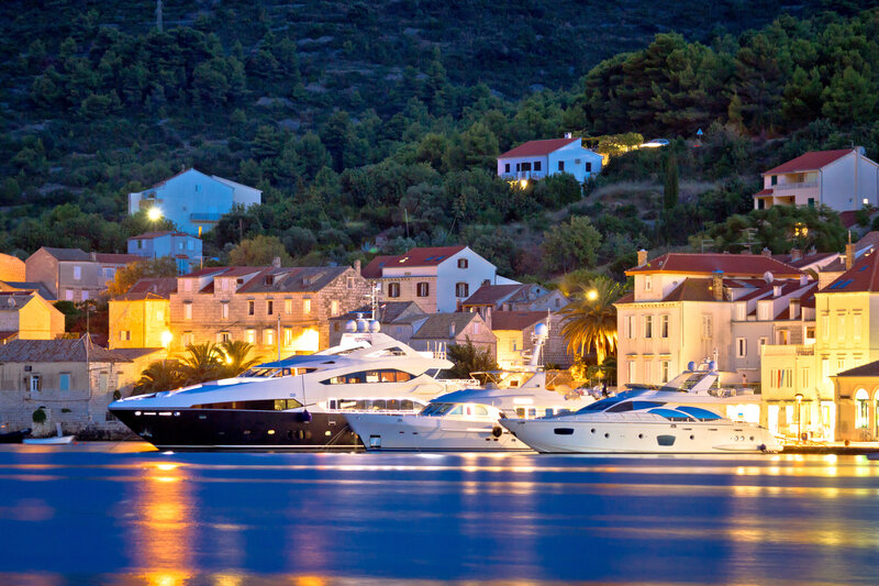 luxury boats anchored infront of Vis town