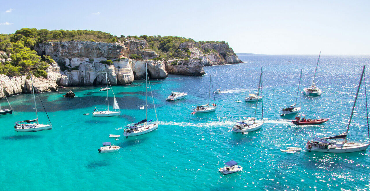 boats anchored in front Macarella beach