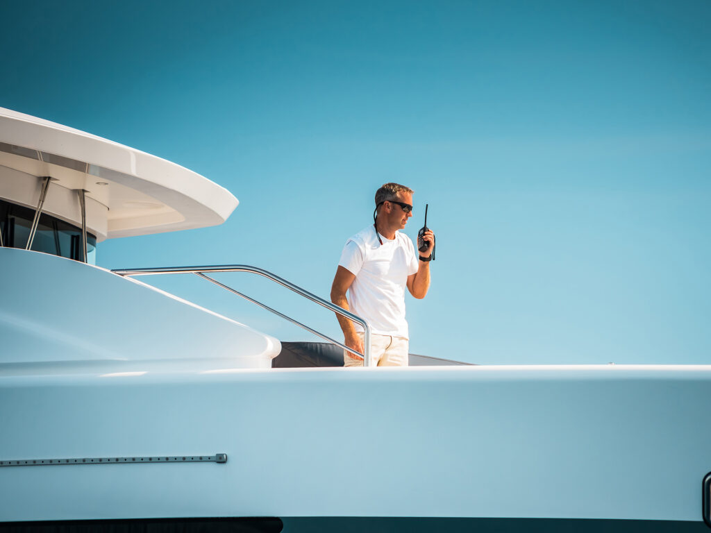 skipper comunicating with crew on a luxury yacht