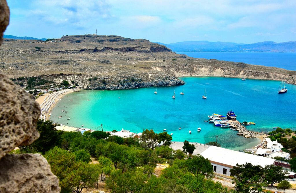 boats anchored in a turquoise bay on Rhodes island