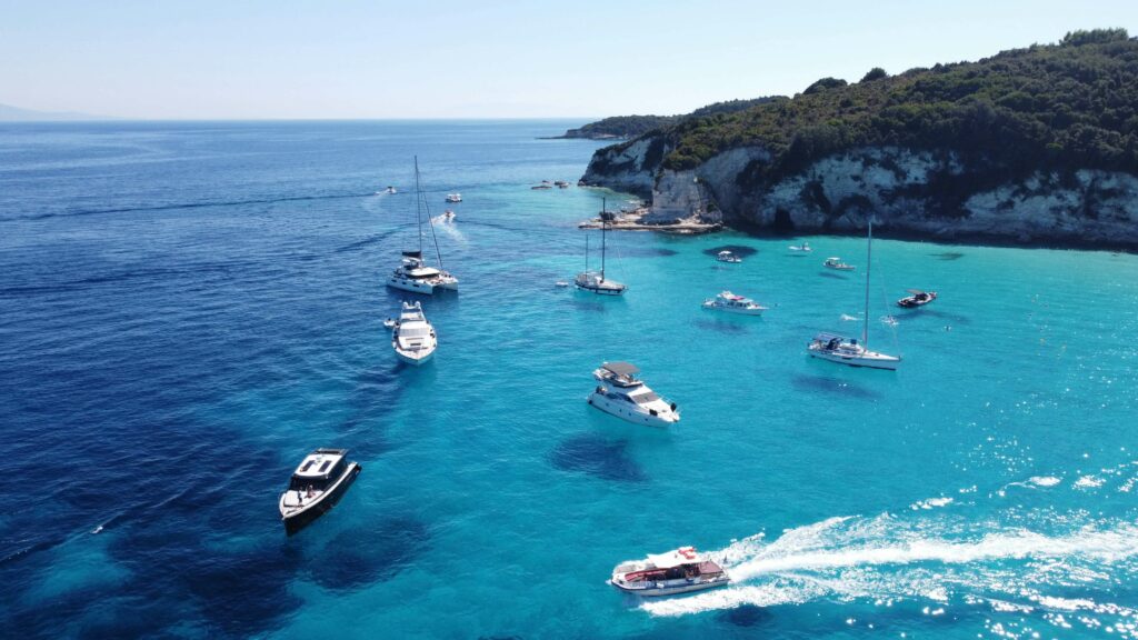 many boats anchored in a turquoise bay